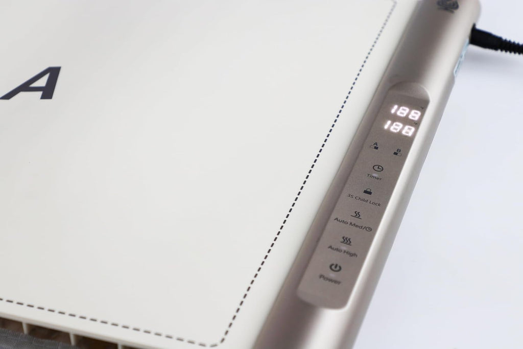 Close-up of the touch control panel with dual temperature displays, timer, child lock and auto heat settings